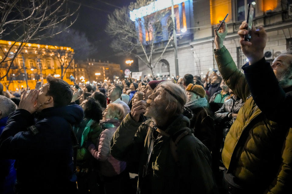 A Serbian opposition supporter blows a whistle during a protest joined by several thousand people, outside the country's electoral commission in Belgrade, Serbia, Monday, Dec. 18, 2023. An early official vote count of Serbia's weekend election on Monday confirmed victory for the ruling populist party in a parliamentary vote in the Balkan country, but political tensions rose over reported irregularities in the capital, Belgrade. (AP Photo/Darko Vojinovic)