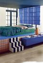 <p>Paint isn’t the only way to inject colour into a room, as this gloriously inventive bedroom inspired by the Memphis group proves (with panache). Choose bright tiles cleanly framed by graphic black grout and primary-hued furniture to emulate its 80s-tinged style – wallflowers need not apply.</p>