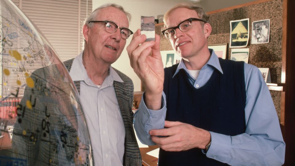 The late physicist Luis Alvarez (left) and Walter Alvarez, professor of Earth and planetary science at the University of California, Berkeley, view a sample of an iridium layer deposit. Based on this layer, the father-and-son research team postulated in a 1980 study that a giant asteroid hit Earth in the Cretaceous Period. - Roger Ressmeyer/Corbis/VCG/Getty Images