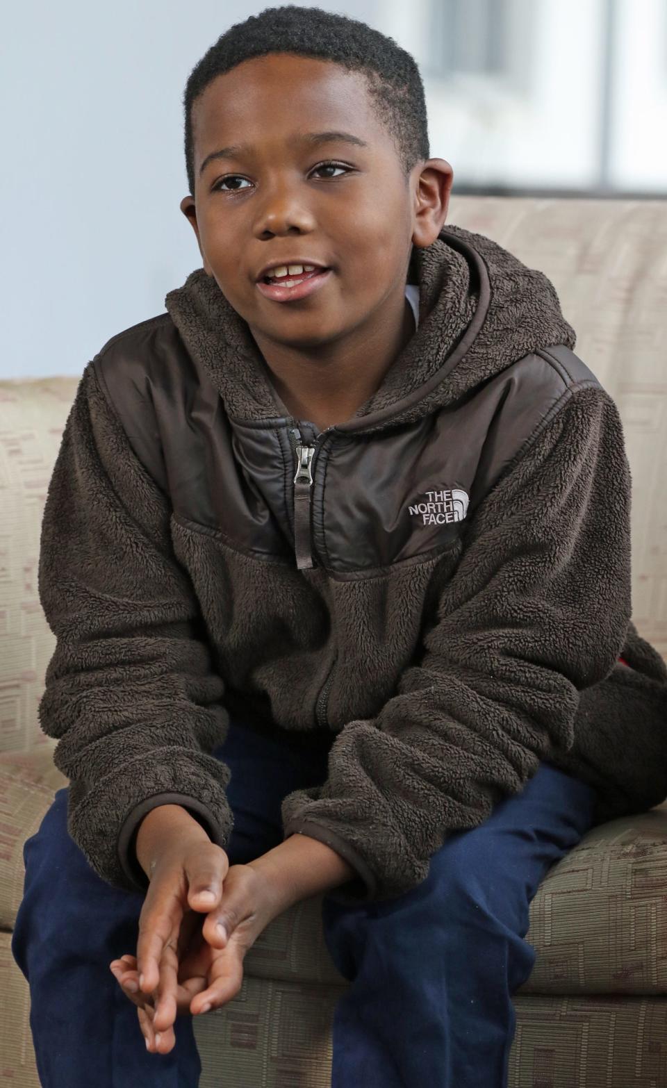 Nine-year-old J.D. Jackson talks to the media about his new eye Thursday afternoon, Dec. 15, 2022, at the offices of the Gaston Gazette.