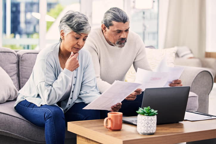 A senior couple comparing healthcare options.