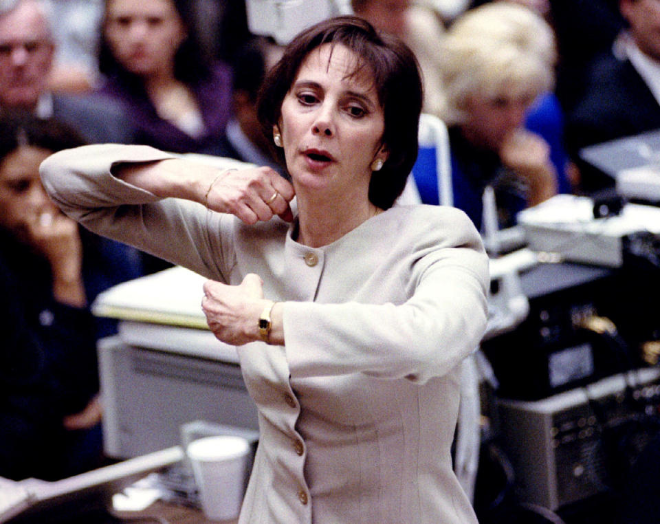 <p>Prosecutor Marcia Clark demonstrates for the jury how the murders of Nicole Simpson and Ronald Goldman were committed as she presents her closing arguments Sept. 26, 1995 at O.J. Simpson’s murder trial. (Photo: Pool/Reuters) </p>