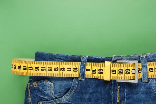 jeans with meter belt slimming on the green background