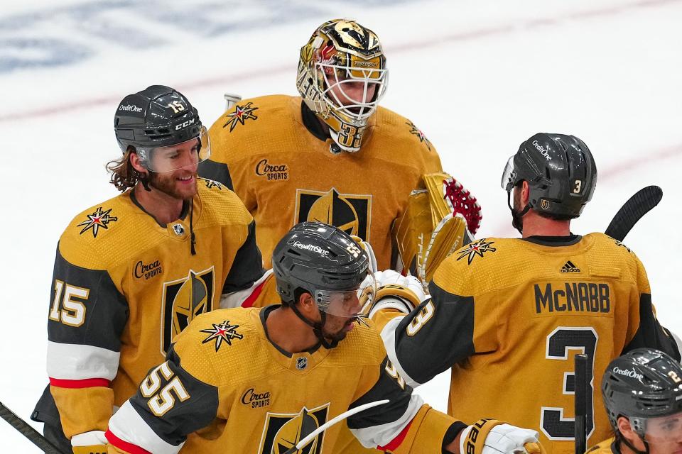 Vegas Golden Knights goaltender Adin Hill (33) celebrates with teammates after a 2-0 victory against the Dallas Stars on Friday.