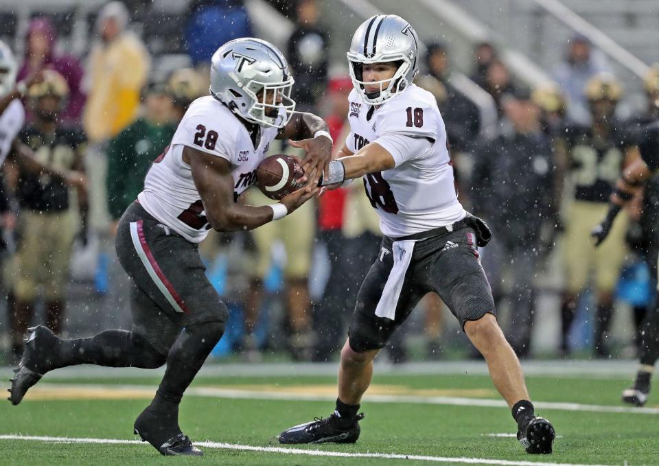 Oct 14, 2023; West Point, New York, USA; Troy Trojans quarterback Gunnar Watson (18) hands off the ball to running back Kimani Vidal (28) during the second half against the Army Black Knights at Michie Stadium. Mandatory Credit: Danny Wild-USA TODAY Sports