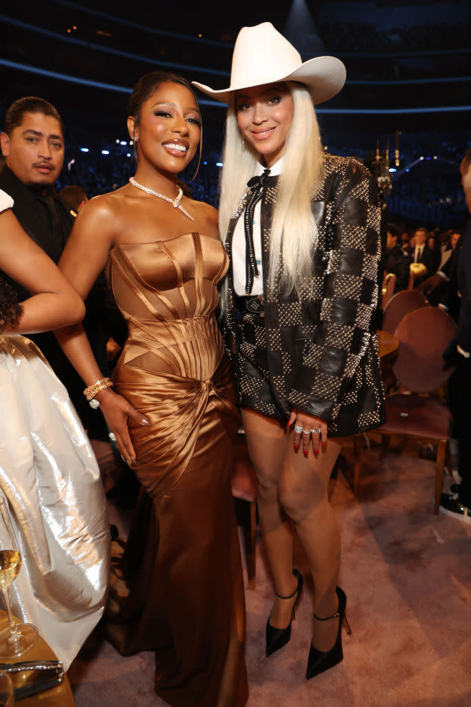 LOS ANGELES, CALIFORNIA - FEBRUARY 04: (L-R) Victoria Monet and Beyoncé attend the 66th GRAMMY Awards at Crypto.com Arena on February 04, 2024 in Los Angeles, California. (Photo by Kevin Mazur/Getty Images for The Recording Academy)