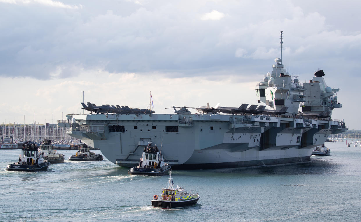 The Royal Navy aircraft carrier HMS Queen Elizabeth arrives back at Portsmouth Naval Base in Hampshire. Picture date: Wednesday May 19, 2021.