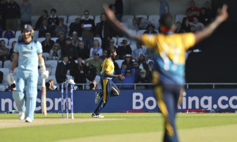 Sri Lanka's Nuwan Pradeep, center, celebrates after taking the last wicket to win the Cricket World Cup match against England in Leeds, England, Friday, June 21, 2019. (AP Photo/Jon Super)