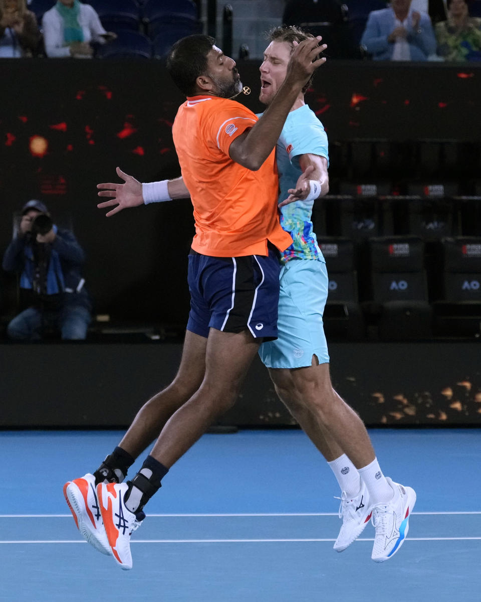 Rohan Bopanna of India and Matthew Ebden, right, of Australia celebrate after defeating Simone Bolelli and Andrea Vavassori of Italy in the men's doubles final the Australian Open tennis championships at Melbourne Park, Melbourne, Australia, Saturday, Jan. 27, 2024.(AP Photo/Alessandra Tarantino)