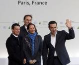 French Ecology Minister Segolene Royal (C) and French Prime Minister Manuel Valls (L) welcome Greek Prime Minister Alexis Tsipras for the opening day of the World Climate Change Conference 2015 (COP21) at Le Bourget, near Paris, France, November 30, 2015. REUTERS/Christian Hartmann