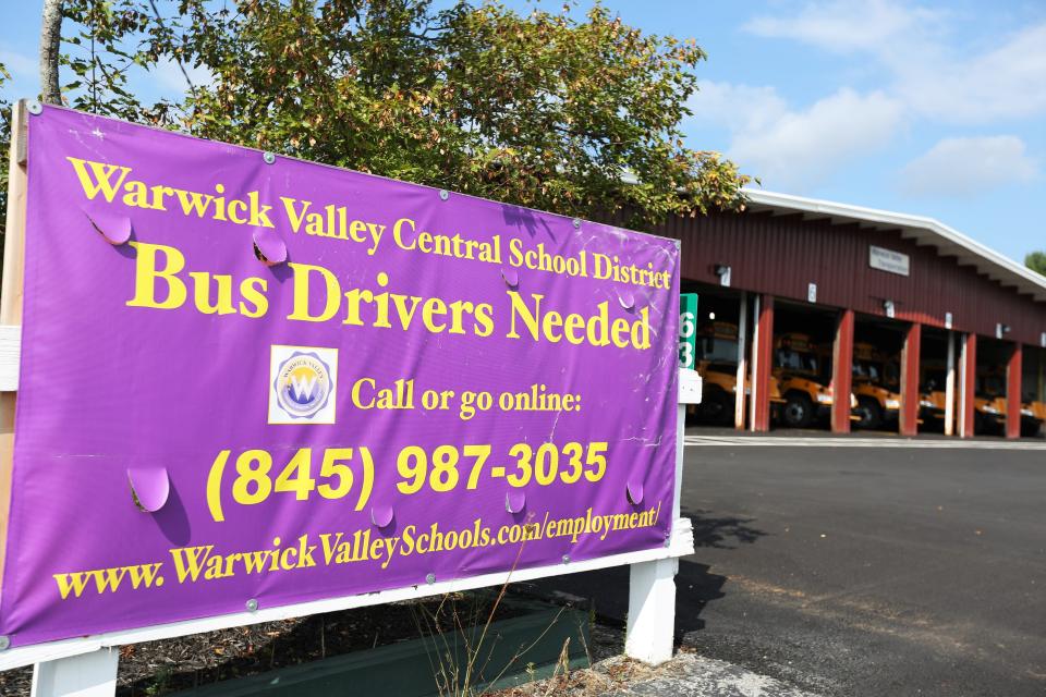 A sign for "Bus Drivers Needed" outside the bus garage for the Warwick Valley Central School District in New York on Sept. 8.