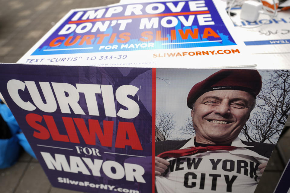 Campaign posters for New York City Republican mayoral candidate Curtis Sliwa are displayed at one of his campaign events in the Washington Heights neighborhood of New York, Tuesday, Oct. 12, 2021. (AP Photo/Mary Altaffer)