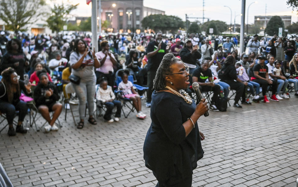 Pastor Claudette Owens, front, leads people in song during a revival for Steve Perkins outside Decatur City Hall on Tuesday, Oct. 10, 2023 in Decatur, Ala. Steve Perkins, 39, was killed by police Sept. 29 in Decatur in a confrontation that began with a tow truck driver trying to repossess Perkins’ truck.(Jeronimo Nisa/The Decatur Daily via AP)