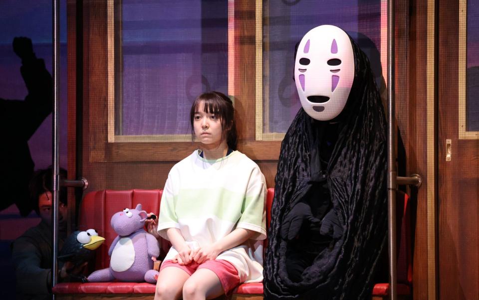 Chihiro and Kaonashi in the play of Spirited Away