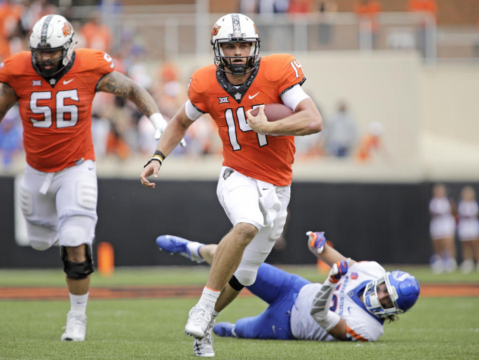 STILLWATER, OK – SEPTEMBER 15: Quarterback Taylor Cornelius #14 of the Oklahoma State Cowboys scrambles against the Boise State Broncos at Boone Pickens Stadium on September 15, 2018 in Stillwater, Oklahoma. (Photo by Brett Deering/Getty Images)