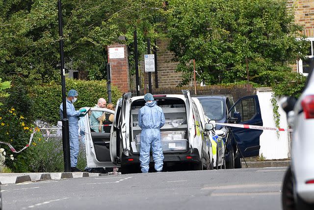 Police and forensics outside the apartment in Shepherd's Bush, west London on July 12, 2024