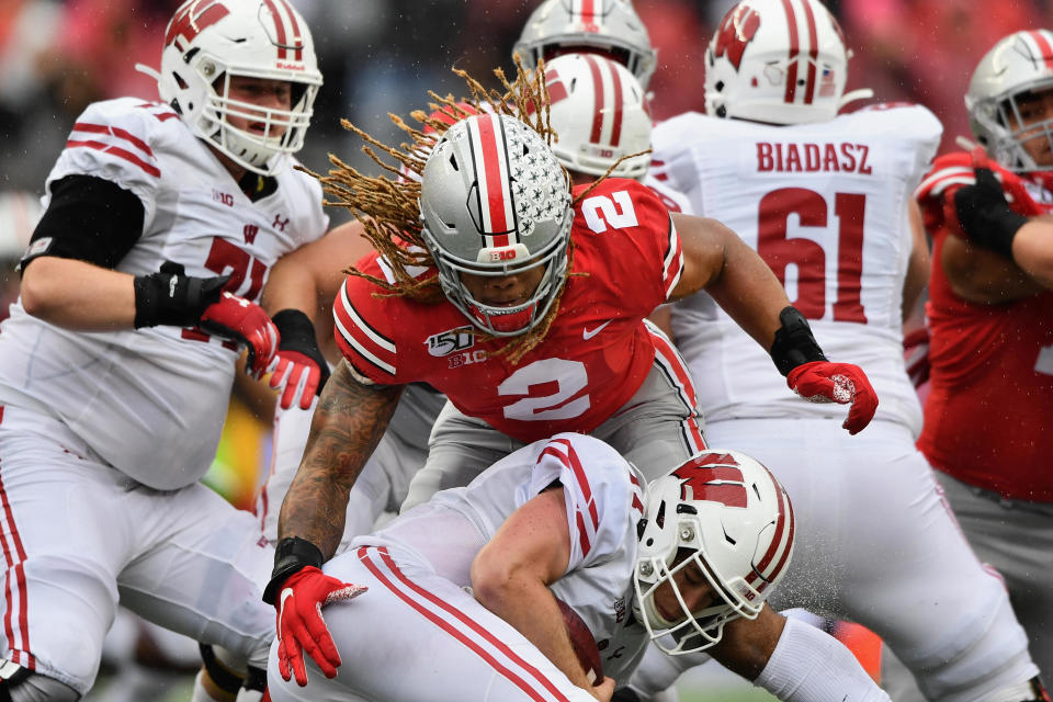 COLUMBUS, OH - OCTOBER 26:  Quarterback Jack Coan #17 of the Wisconsin Badgers is sacked in the second quarter by Chase Young #2 of the Ohio State Buckeyes at Ohio Stadium on October 26, 2019 in Columbus, Ohio.  (Photo by Jamie Sabau/Getty Images)