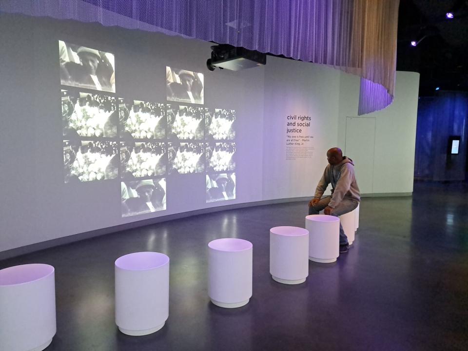 Maynard Fuggent watches footage from the civil rights movement at the Museum of Tolerance