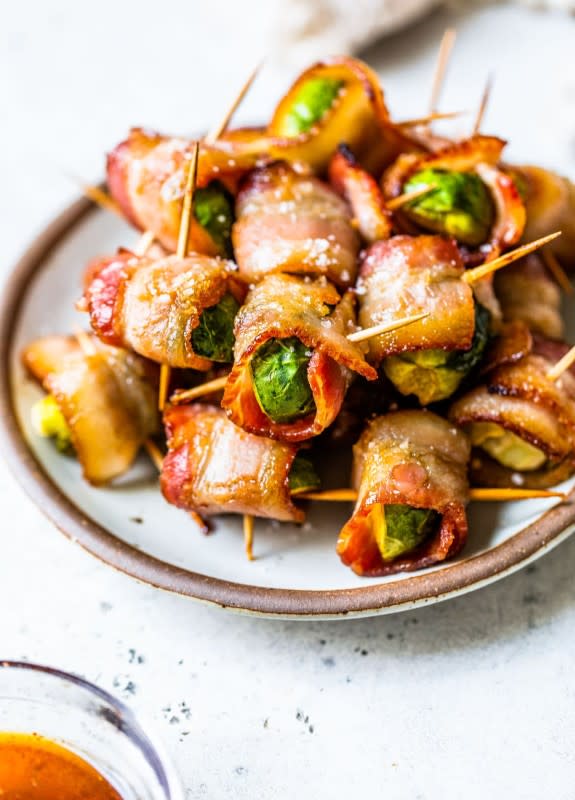 <p>Well Plated</p><p>If you think you don't like Brussels Sprouts, think again!</p><p><strong>Get the recipe: <a href="https://www.wellplated.com/bacon-wrapped-brussels-sprouts/" rel="nofollow noopener" target="_blank" data-ylk="slk:Bacon Wrapped Brussels Sprouts;elm:context_link;itc:0;sec:content-canvas" class="link ">Bacon Wrapped Brussels Sprouts</a></strong></p>