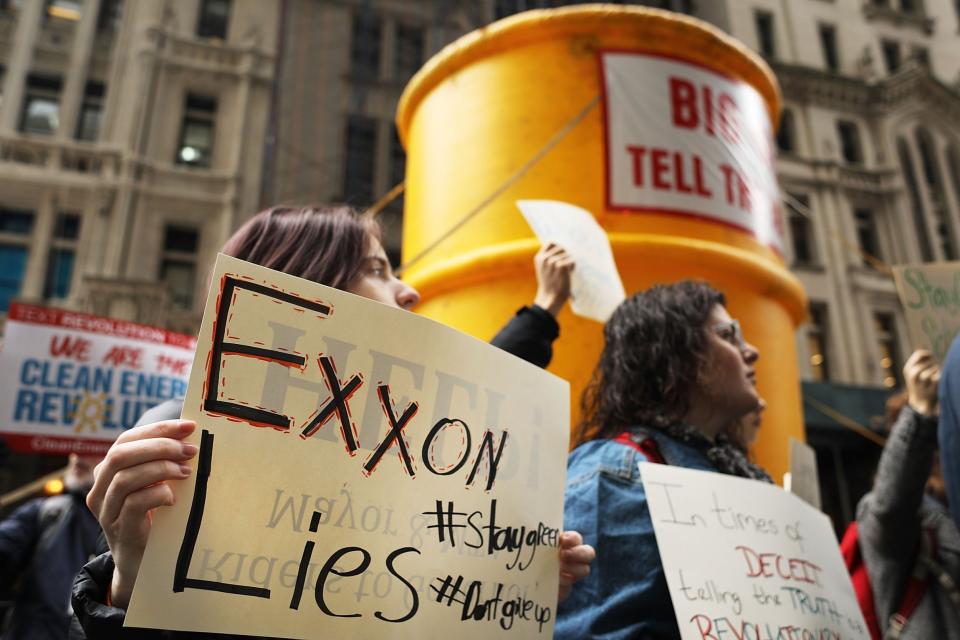 Activists rallying outside New York's attorney general office in 2017 to support the investigation into whether oil giant Exxon covered up its knowledge about climate change: Getty