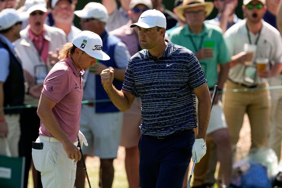 Scottie Scheffler pumps his fist after chipping in on No. 3 during the final round of the 2022 Masters.