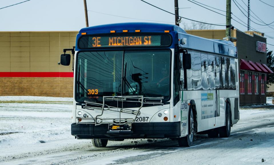 An IndyGo bus makes its way Friday, Dec. 23, 2022, along West Michigan Street in Indianapolis after a storm brought snow, high wind gusts and frigid temperatures to Central Indiana. 