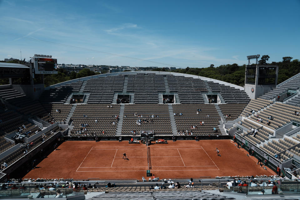 Czech Republic's Petra Kvitova, left, returns the ball to Belgium's Greet Minnen during their first round match of the French Open tennis tournament on the Suzanne Lenglen court of the Roland Garros stadium Sunday, May 30, 2021 in Paris. (AP Photo/Thibault Camus)