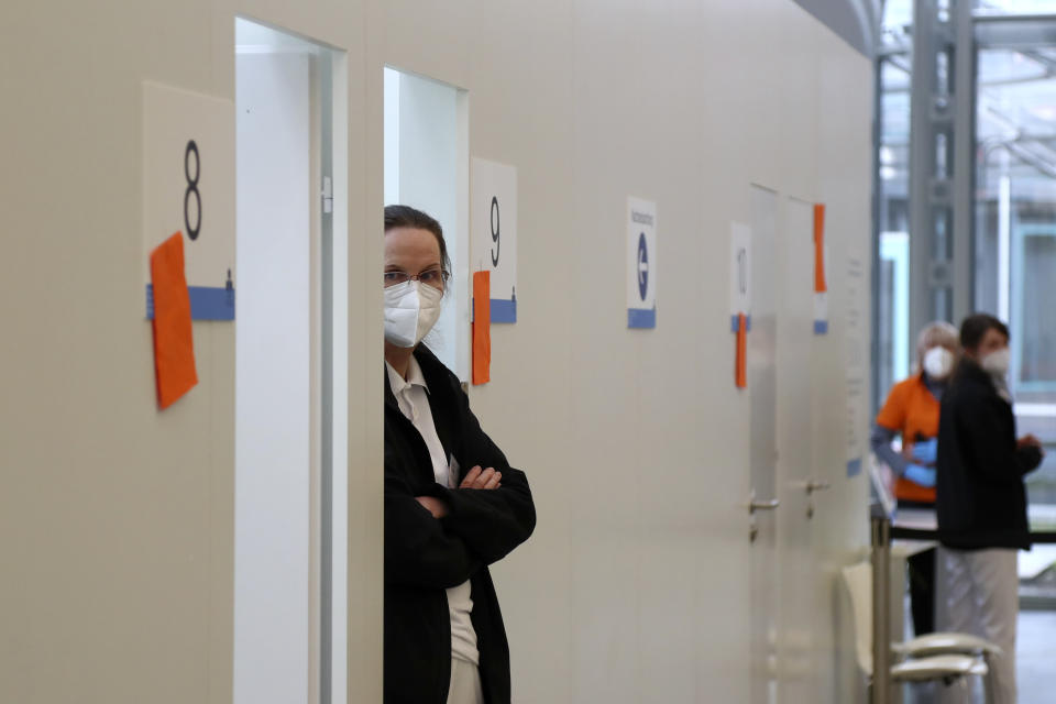 Medical staff wait for people at a local vaccination centre as the spread of the coronavirus disease (COVID-19) continues in Ebersberg near Munich, Germany, Monday, March 22, 2021. (AP Photo/Matthias Schrader)