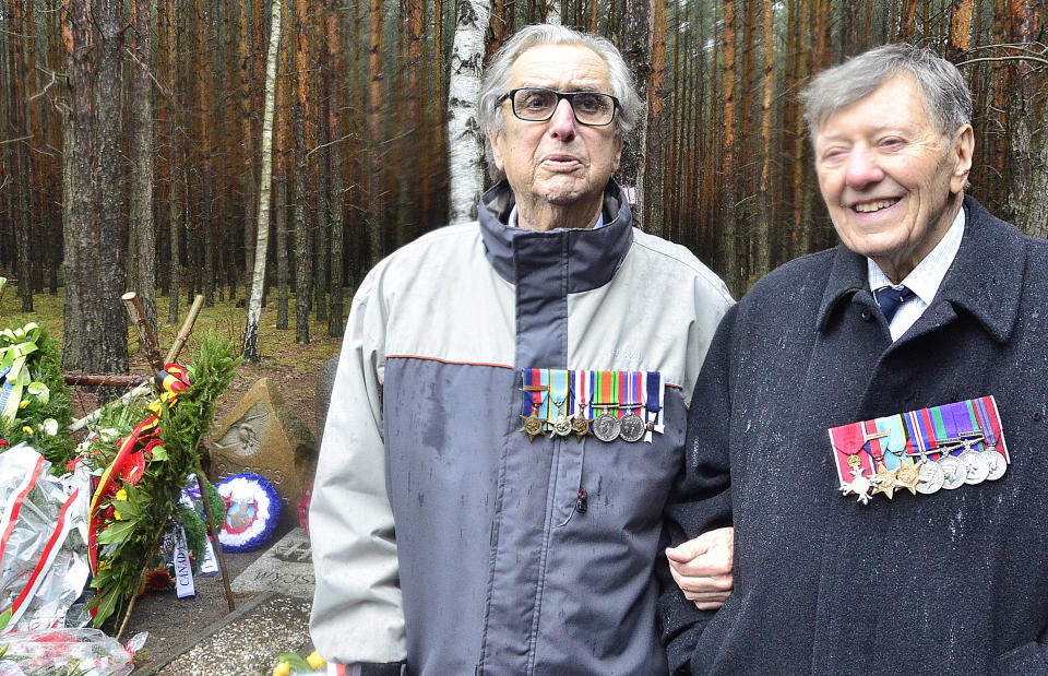 In this picture taken Monday, March 24, 2014, former prisoners of war of the Nazi Stalag Luft III, Andrew Weisman, left, and Charles Clarke, right, are pictured during observances of the 70th anniversary of the Great Escape of Allied airmen from the camp near Zagan, Poland. Weisman and Clarke, both British, were prisoners at the camp after the escape that took place on the night of March 24, 1944, when a group of 76 prisoners emerged from a tunnel they had made in order to flee. Only three airmen made it home. Fifty others were executed when caught, and 23 were sent to other camps, but survived the war. The 1963 Hollywood movie "The Great Escape," starring Steve McQueen, tells the story. (AP Photo/Jan Mazur)