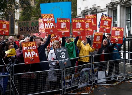 Demonstrators react on the ruling of the Supreme Court during a protest outside the Supreme Court in London
