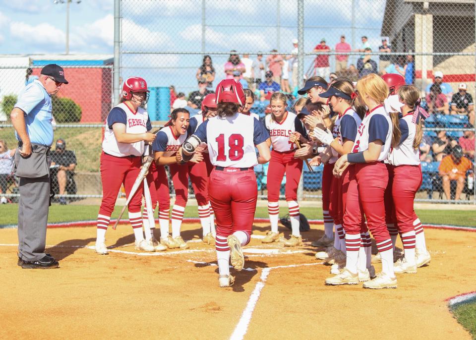 Tipton-Rosemark at home plate awaits catcher  Myah Wrightc(18) after she hits a homerun during a high school softball, Thursday May 20, 2021, in Millington Tenn.