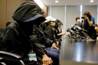 Family members of twelve Hong Kong activists hold a news conference to seek help in Hong Kong