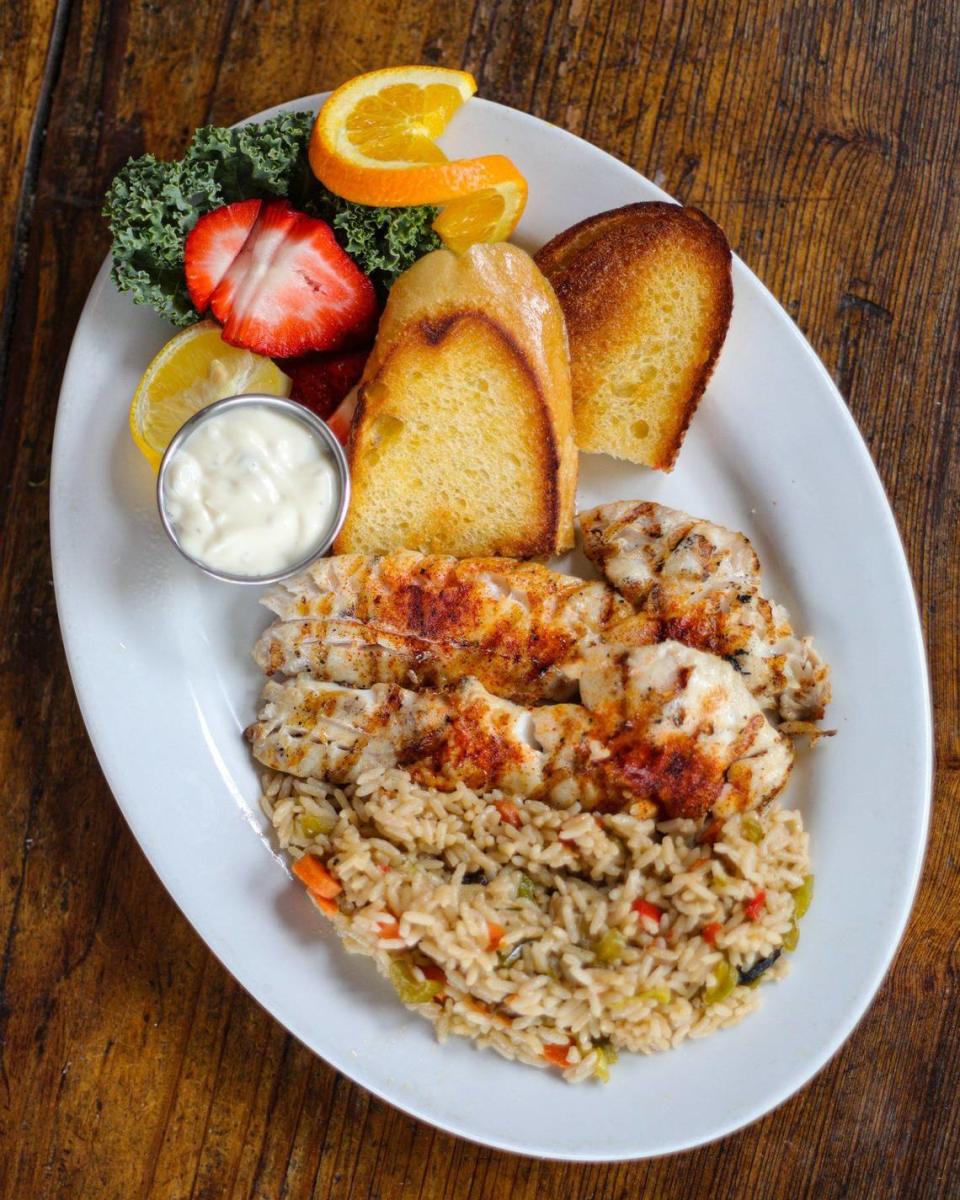 Freshly-caught red snapper is served with rice at Sea Shanty restaurant in Cayucos, celebrating its 40th anniversary under owners Bill Shea and Carol Kramer.