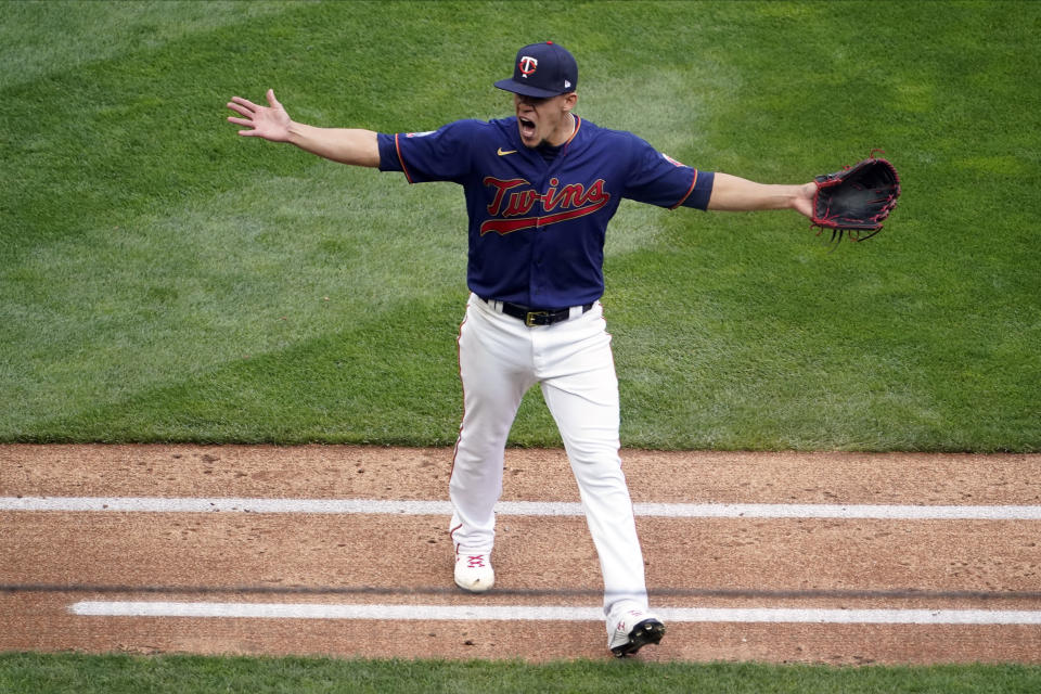 Minnesota Twins pitcher Jose Berrios celebrates an inning-ending out against the Houston Astros in the fourth inning of Game 2 of an American League wild-card baseball series, Wednesday, Sept. 30, 2020, in Minneapolis. (AP Photo/Jim Mone)