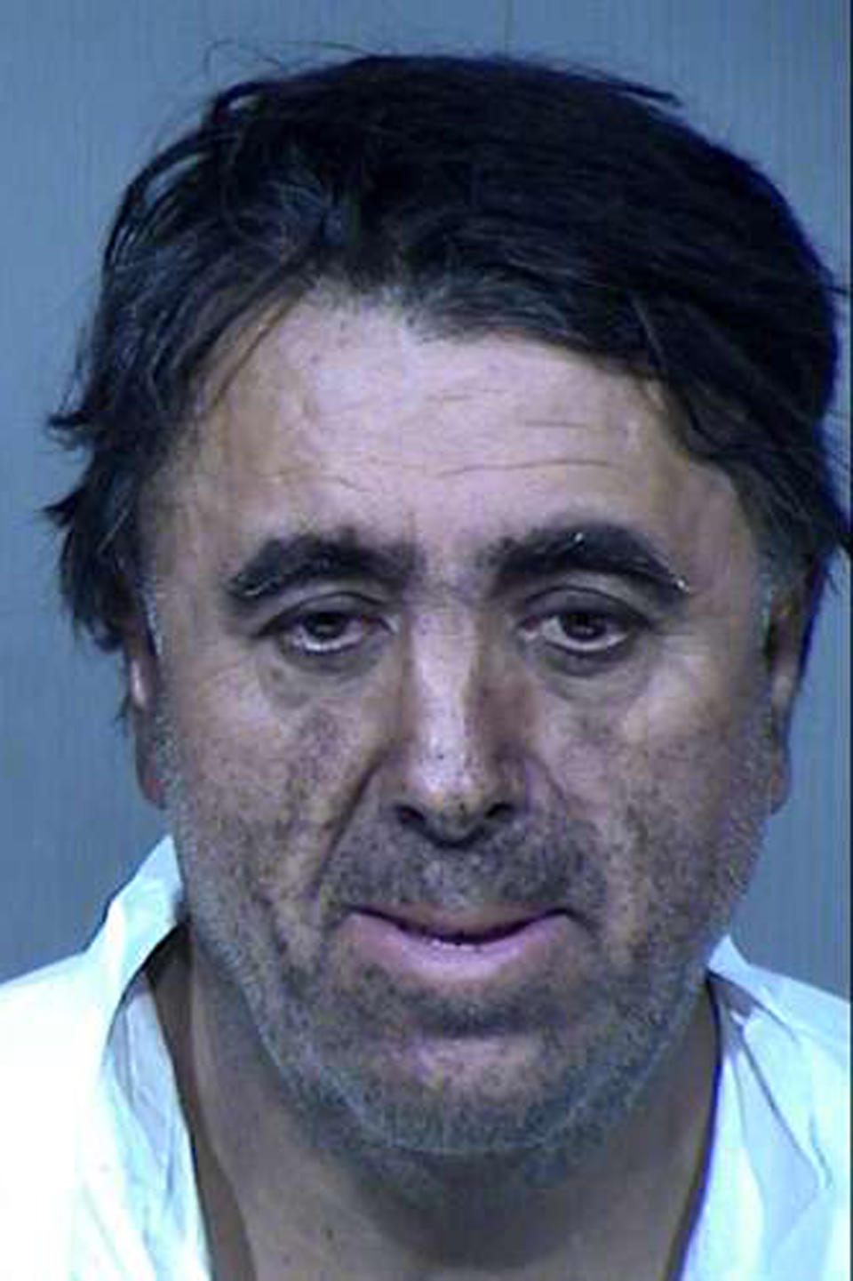This undated booking photo provided by the Maricopa County Sheriff's Office shows 56-year-old Rafael Loera. Loera and his wife, 50-year-old Maribel Loera, are accused of intentionally setting their west Phoenix home ablaze after their children were taken by the state, leading firefighters to find unidentified skeletal remains. They have been booked on suspicion of arson, child abuse and concealment of a dead body. Authorities haven't determined whether the remains belong to a child or adult. (Maricopa County Sheriff's Office via AP)