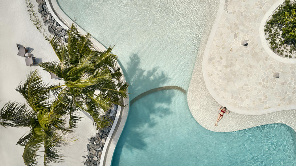 A pool at Patina Maldives  