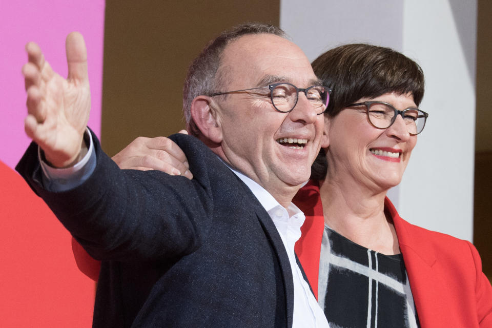 30 November 2019, Berlin: Norbert Walter-Borjans and Saskia Esken wave after the announcement of the result of the vote on the SPD chairmanship in the Willy Brandt House. Walter-Borjans and Esken have won the vote. The new leadership will be confirmed at the party conference on December 6. Photo: Jörg Carstensen/dpa (Photo by Jörg Carstensen/picture alliance via Getty Images)