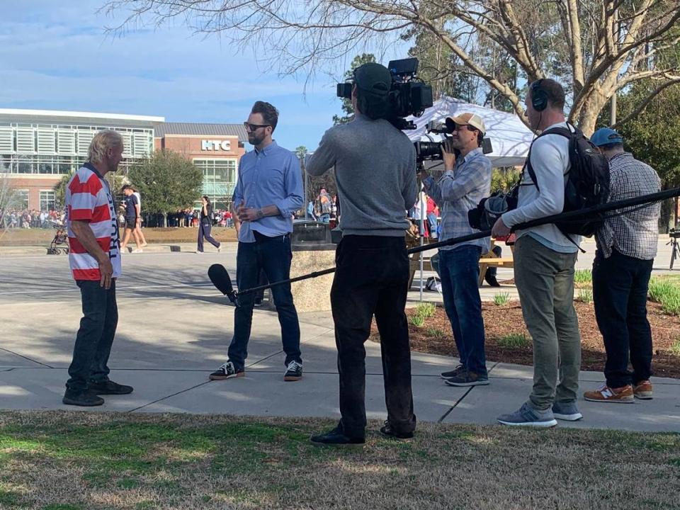 Comedian and The Daily Show correspondent is seen talking to people attending the Donald Trump presidential rally at Coastal Carolina University in Conway Saturday, Feb. 10, 2024. Joe Bustos