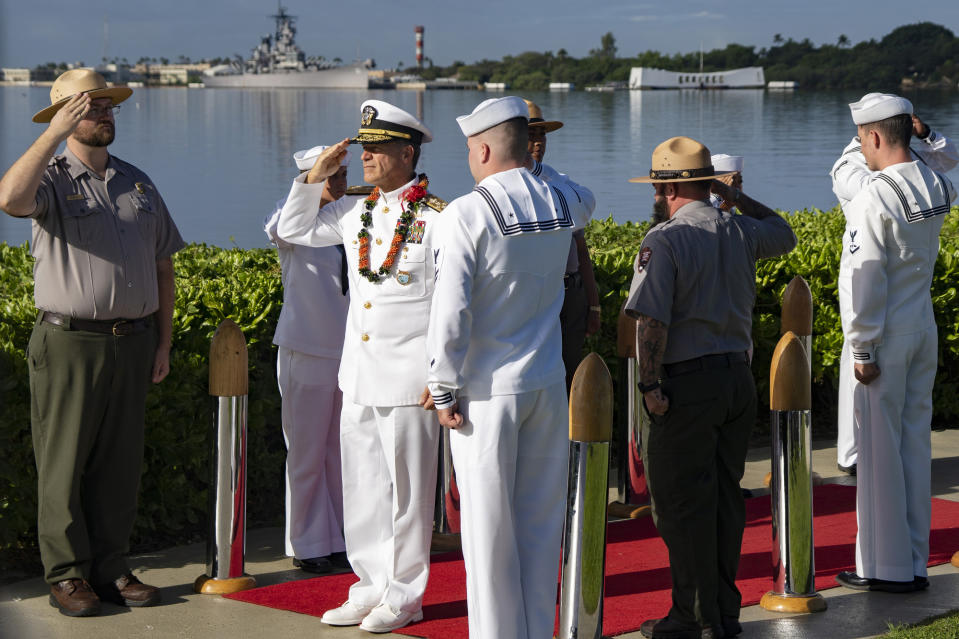 Admiral John C. Aquilino, Commander of the United States Indo-Pacific Command, salutes as he leaves the 82nd Pearl Harbor Remembrance Day ceremony on Thursday, Dec. 7, 2023, at Pearl Harbor in Honolulu, Hawaii. (AP Photo/Mengshin Lin)