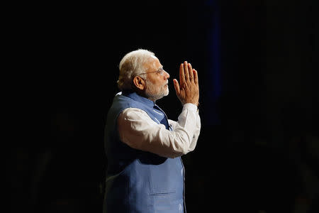 Prime Minister Narendra Modi reacts as he speaks to members of the Australian-Indian community during a reception at the Allphones Arena located at Sydney Olympic Park in western Sydney November 17, 2014. REUTERS/Rick Stevens