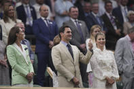 Roger Federer in the Royal Box next to Britain's Kate Princess of Wales, and his wife Mirka Federer, right, is honoured at Centre Court ahead of play on day two of the Wimbledon tennis championships in London, Tuesday, July 4, 2023. Eight-time Wimbledon Champion Roger Federer announced his retirement last year. (AP Photo/Alberto Pezzali)