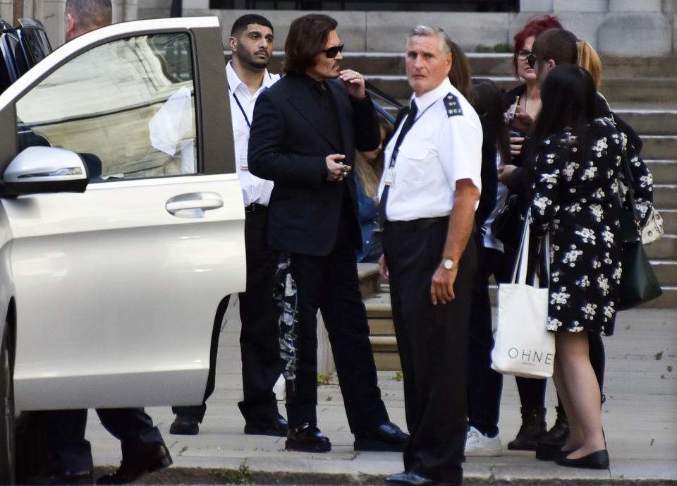 Actor Johnny Depp leaves the High Court, in London, Monday, July 20, 2020. Amber Heard started to give evidence Monday at the High Court in London, as part of Johnny Depp's libel case against The Sun over allegations of domestic violence during the couple's relationship. (AP Photo/Alberto Pezzali)