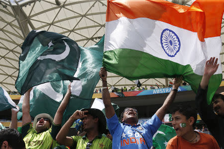 Fans of Pakistan's cricket team (L) and India's (R) cheer in the stands before Pakistan's Cricket World Cup match against India in Adelaide, February 15, 2015. REUTERS/David Gray/File Photo