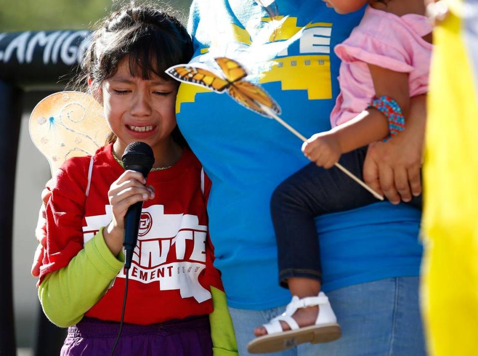 Akemi Vargas, 8, cries Monday as she talks about being separated from her father in Phoenix.