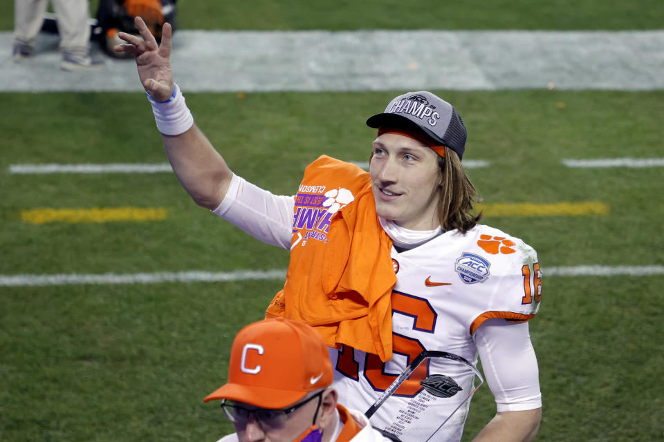 Trevor Lawrence acknowledges fans as he walks off the field after defeating the Notre Dame Fighting Irish 34-10 in the ACC Championship. (Jared C. Tilton/Getty Images)