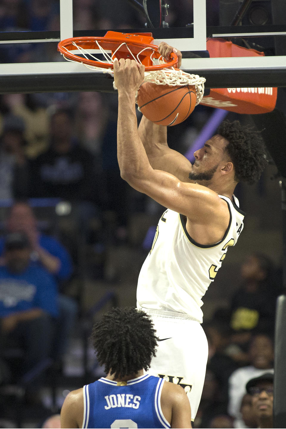 Wake Forest center Olivier Sarr dunks during the second half of the team's NCAA college basketball game against Duke on Tuesday, Feb. 25, 2020, in Winston-Salem, N.C. (AP Photo/Lynn Hey)