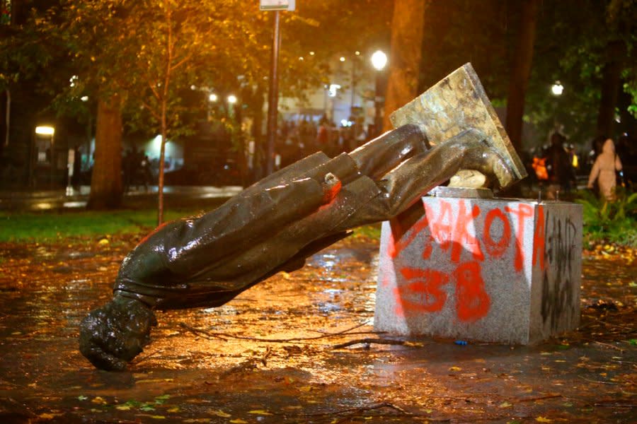 File: <em>A group of protesters toppled statues of former presidents Theodore Roosevelt and Abraham Lincoln in Portland’s South Park Block late Sunday, Oct. 11, 2020. (Sean Meagher/The Oregonian via AP)</em>