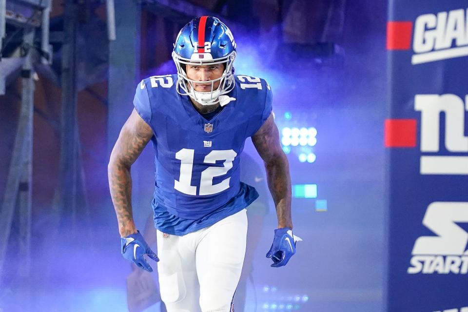 New York Giants tight end Darren Waller (12) runs onto the field as he in introduced before an NFL football game against the Seattle Seahawks on Monday Oct. 2, 2023, in East Rutherford, NJ. (AP Photo/Bryan Woolston)