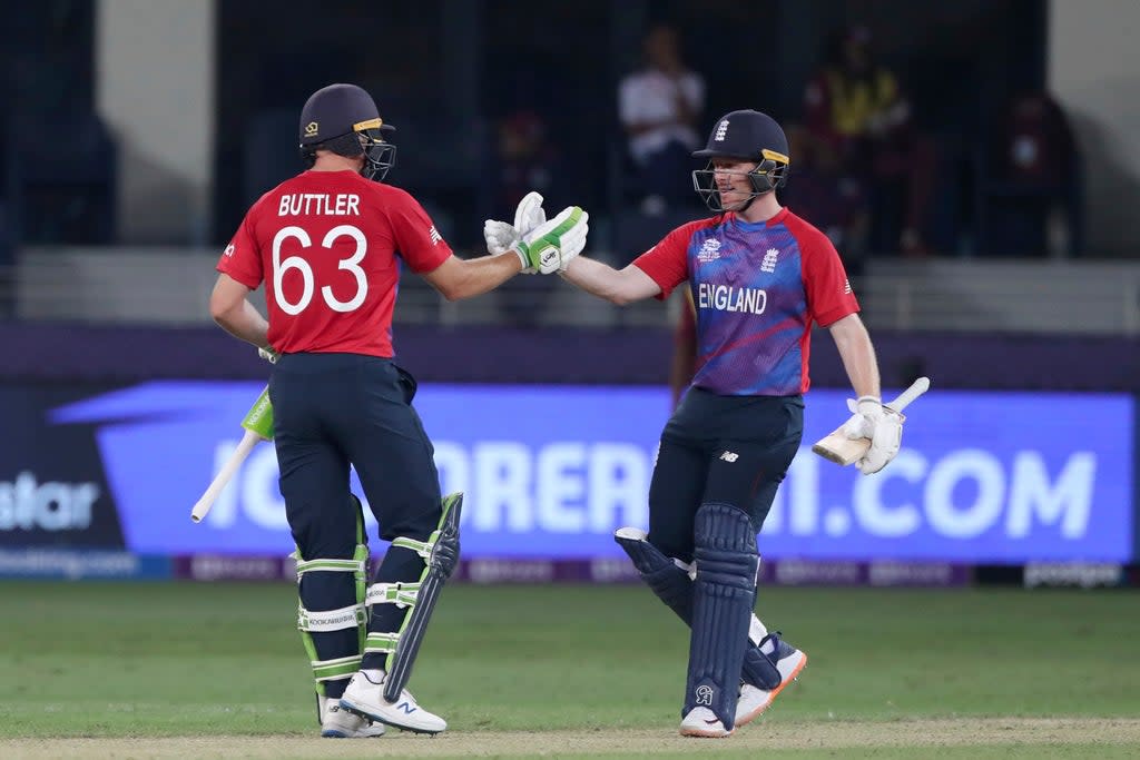 England captain Eoin Morgan, right, and Jos Buttler celebrate victory (Aijaz Rahi/AP). (AP)