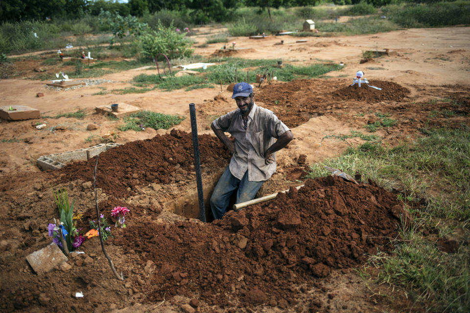 Cemetery worker Denny Pereyra rests momentarily while digging graves for children in an area of the municipal cemetery reserved for common graves in Maracaibo, Venezuela, Nov. 28, 2019. Death has become an overwhelming financial burden for many of Venezuela’s poorest, who already struggle to find dignity in life. (AP Photo/Rodrigo Abd)